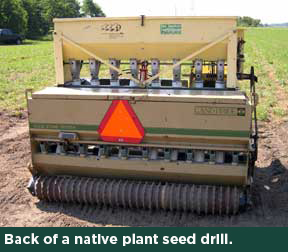 Back of a native-plant seed drill.